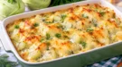 Überbackene Kohlrabistücke in cremiger Käse-Dill-Soße mit goldbrauner Oberfläche.